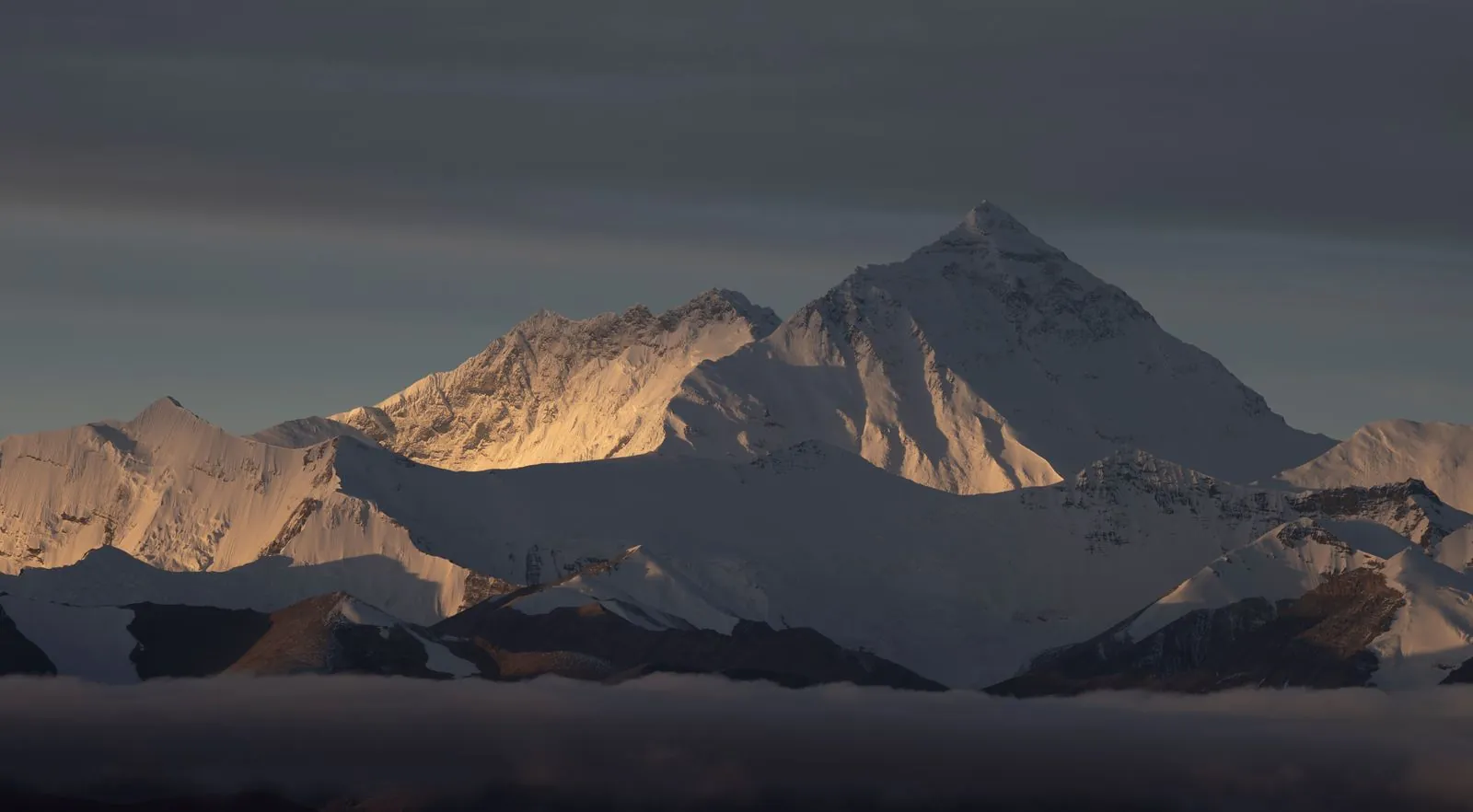 Mount Everest illuminated at sunrise from the Tibet side